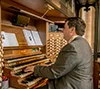 Robin at the Organ of Tewkesbury Abbey, UK